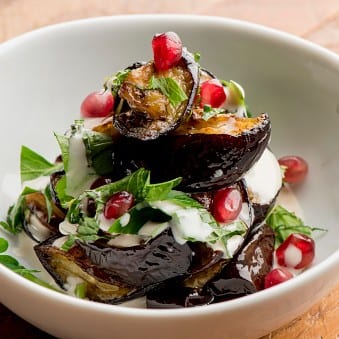 Burnt eggplant with tahini, parsley, pomegranate molasse (v)